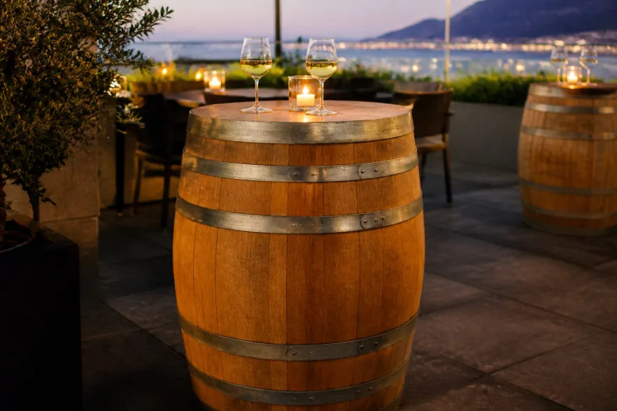 Full wine barrel freestanding bar table at an outdoor restaurant